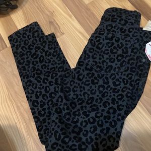 Black leopard skinny jeans